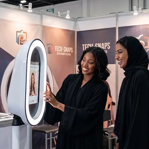 Guests having fun with quirky props inside a vintage strip photo booth by Mirror Booth Dubai.